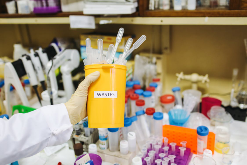 Several pieces of empty pipettes in a cup.